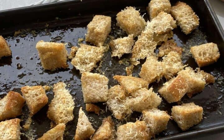 Baked croutons on a baking tray